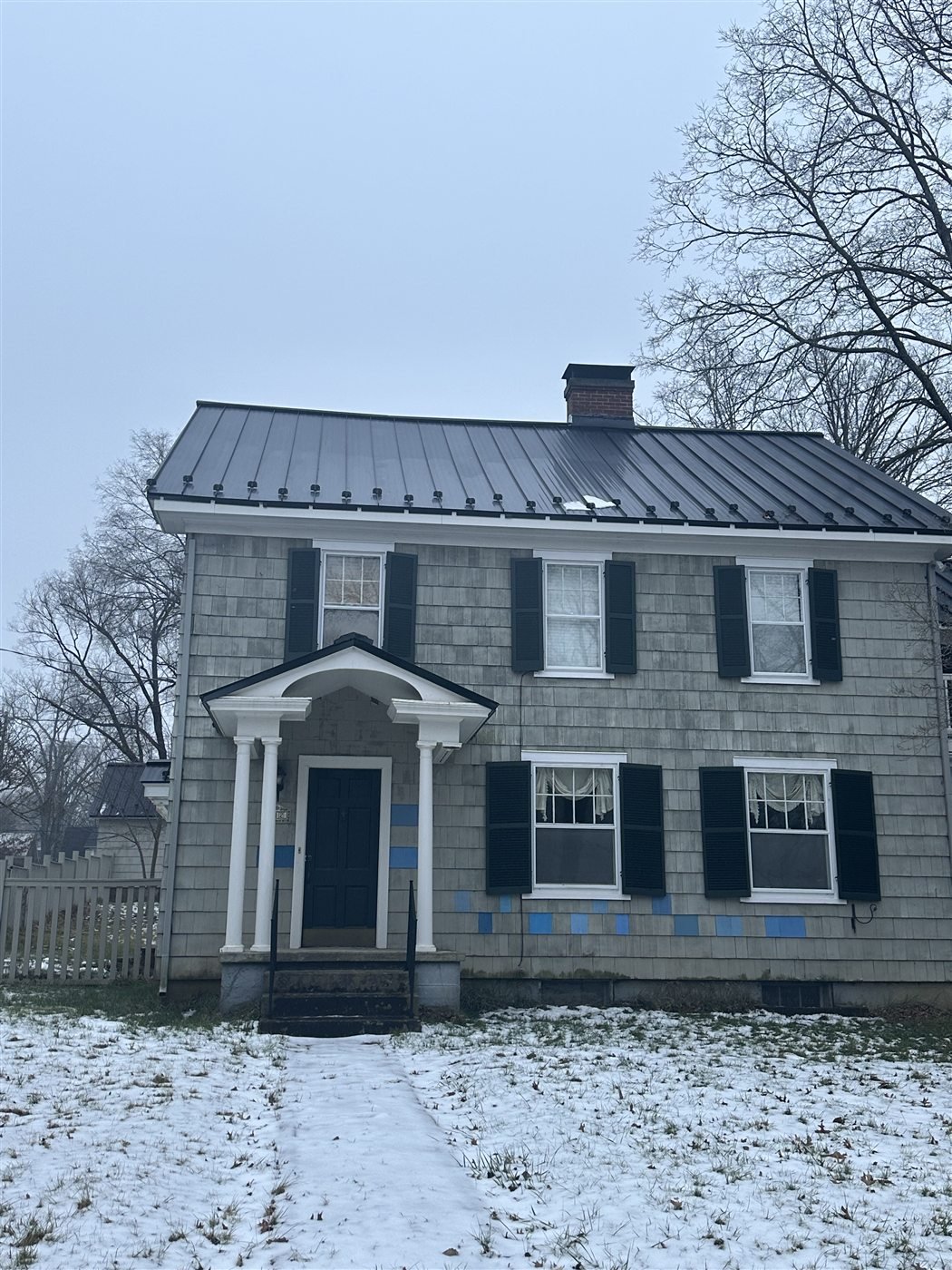 Standing seam metal roof on a colonial home