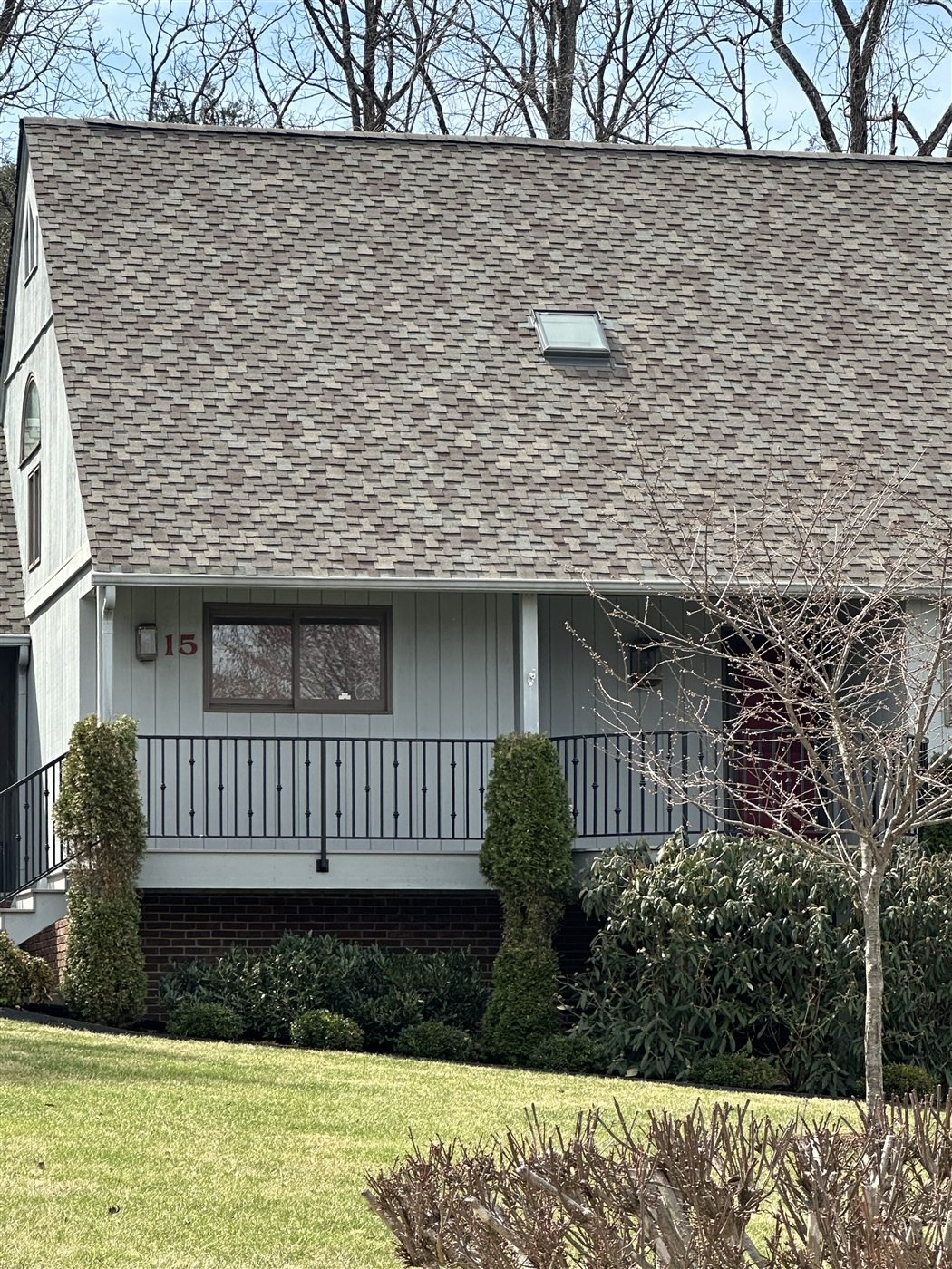 Home with a completed architectural shingle roof